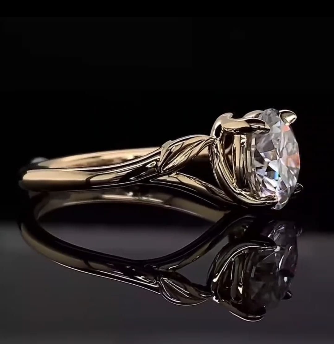 Side profile shot of a 3 carat round brilliant lab grown diamond with sculpted leaf band.