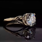 Perspective view displaying brilliance of 3 CT round lab diamond and organic split shank.