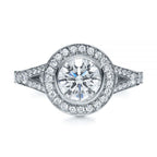 Direct top-down view of a 3 carat round cut lab diamond with bezel halo and split pave shank.