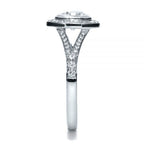 Side profile detailing the pave split-shank architecture and bezel setting of a white gold ring.