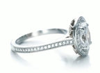 Side view showing milgrain-edged pavé band and halo profile of a 3 CT marquise lab diamond ring.