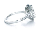 Angled perspective of white gold marquise diamond engagement ring showing side pavé stones.