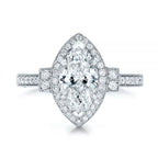 Studio top-down view of a 3 CT marquise lab diamond engagement ring on white background.