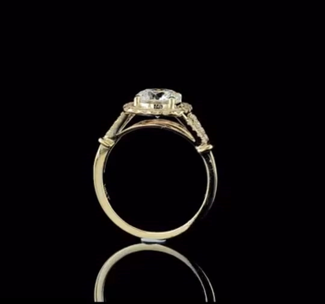 Full side view highlighting the ring profile, bridge structure, and polished yellow gold band.