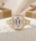 Detailed undergallery view of a gold emerald cut vintage engagement ring showing intricate filigree craftsmanship