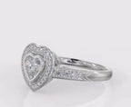 Side angle view showing the heart bezel halo, pave shank, and chevron details on a white gold ring.