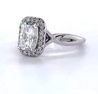 Angled front view of a 2 CT radiant cut lab grown diamond engagement ring with halo and twisted band.