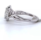 Side profile view showing the polished twist split shank and cathedral halo setting on white gold ring.