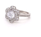 Angled view showing the brilliant 2 carat round lab grown diamond and glittering pave diamond band.