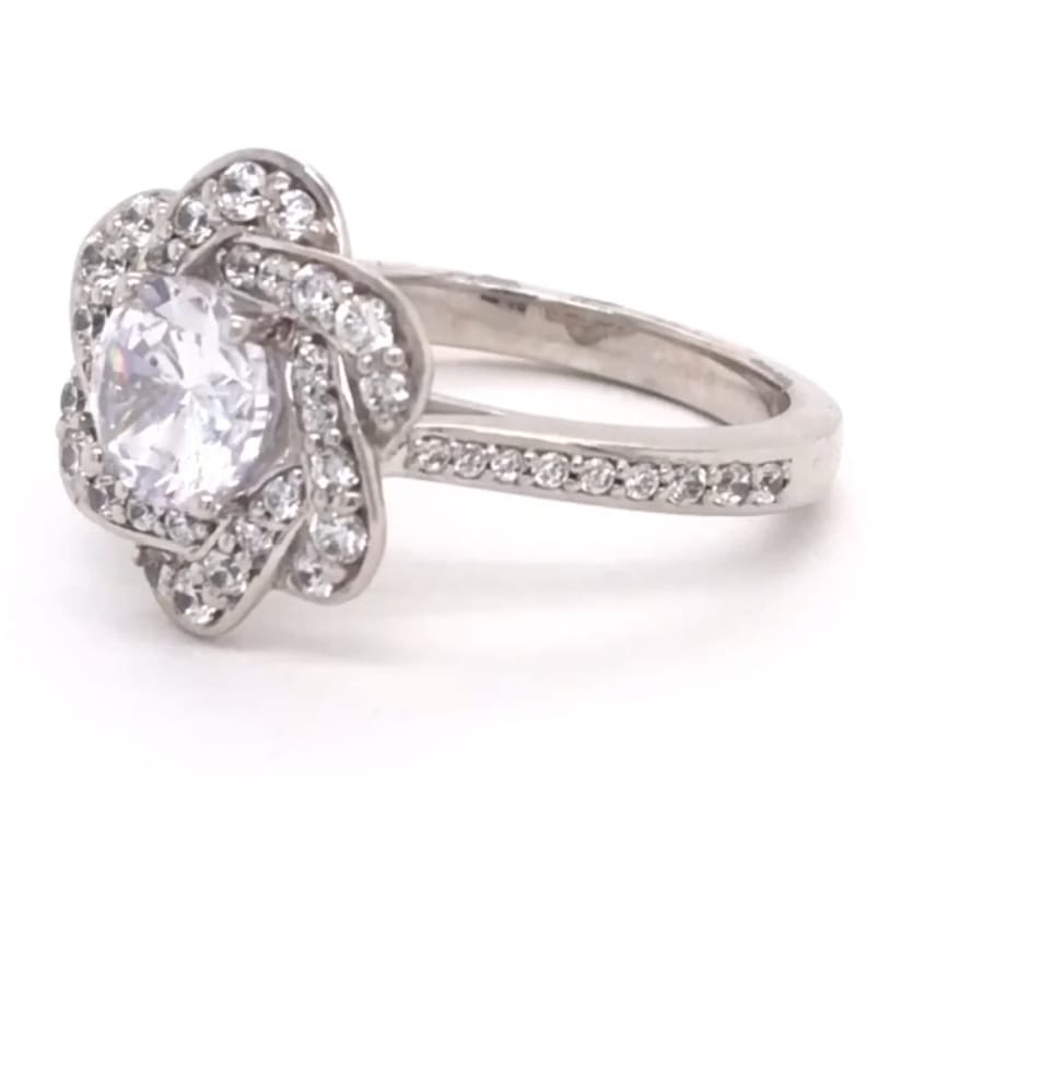 Side view showing the detailed setting and pave side stones on the 2 CT round lab diamond engagement ring.