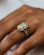 Angled close-up of 2 carat canary yellow radiant cut lab diamond ring showing split shank pave band detail.