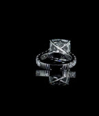 Bottom-up gallery view highlighting the cross-prong setting and smooth inner band of a 4 CT cushion cut lab diamond ring.