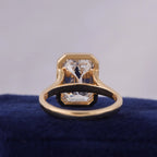 Inner band and under-gallery view of a 3 CT emerald cut lab grown diamond ring in a yellow gold bezel setting.