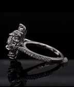 Side profile view of a 3 carat round lab grown diamond ring showing the basket setting and pavé band