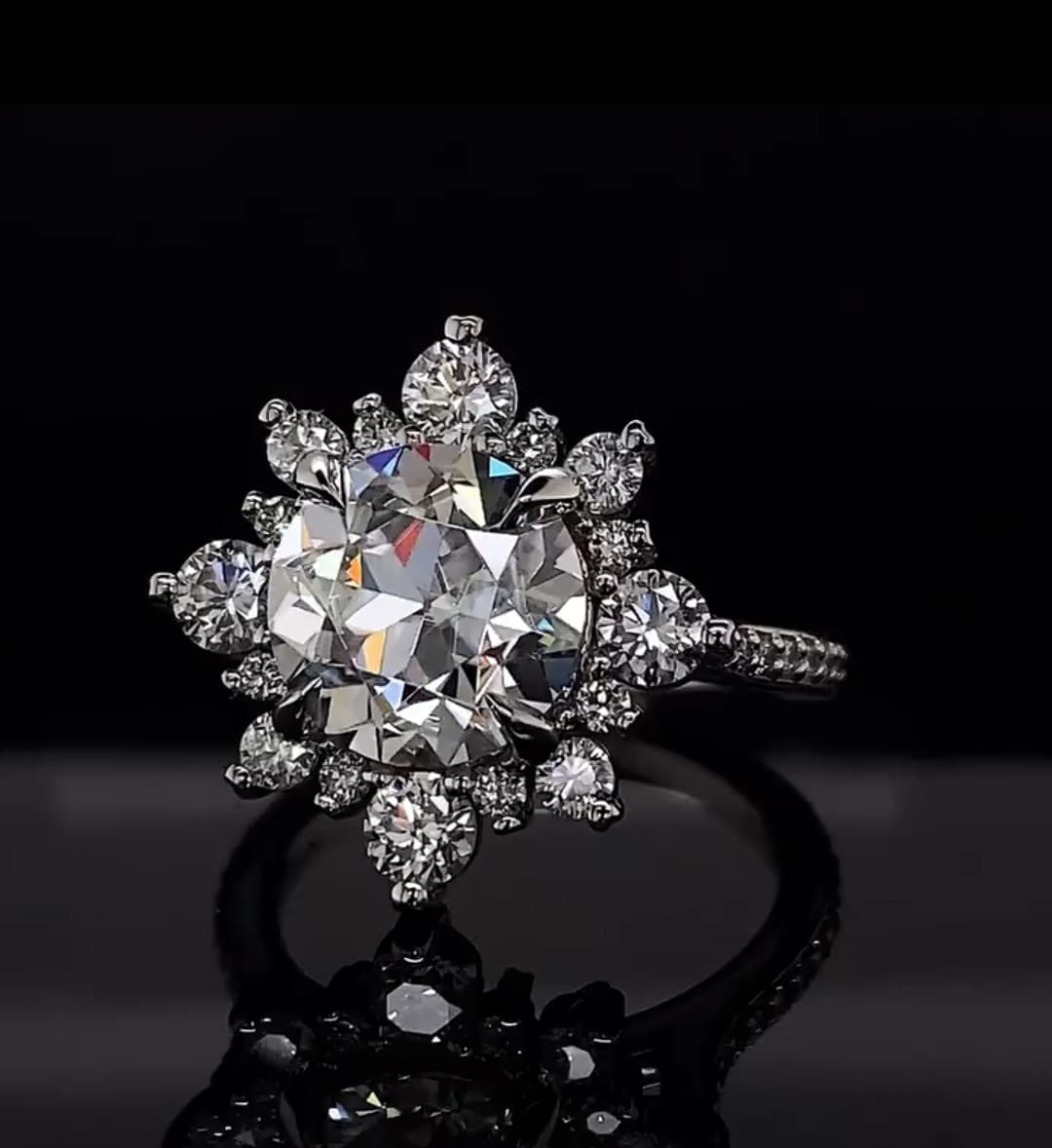 Close-up top view showing the brilliance of a 3 carat round lab diamond surrounded by a sunburst halo