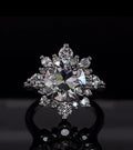 Front-facing shot of a 3 CT round lab grown diamond engagement ring with starburst halo detail