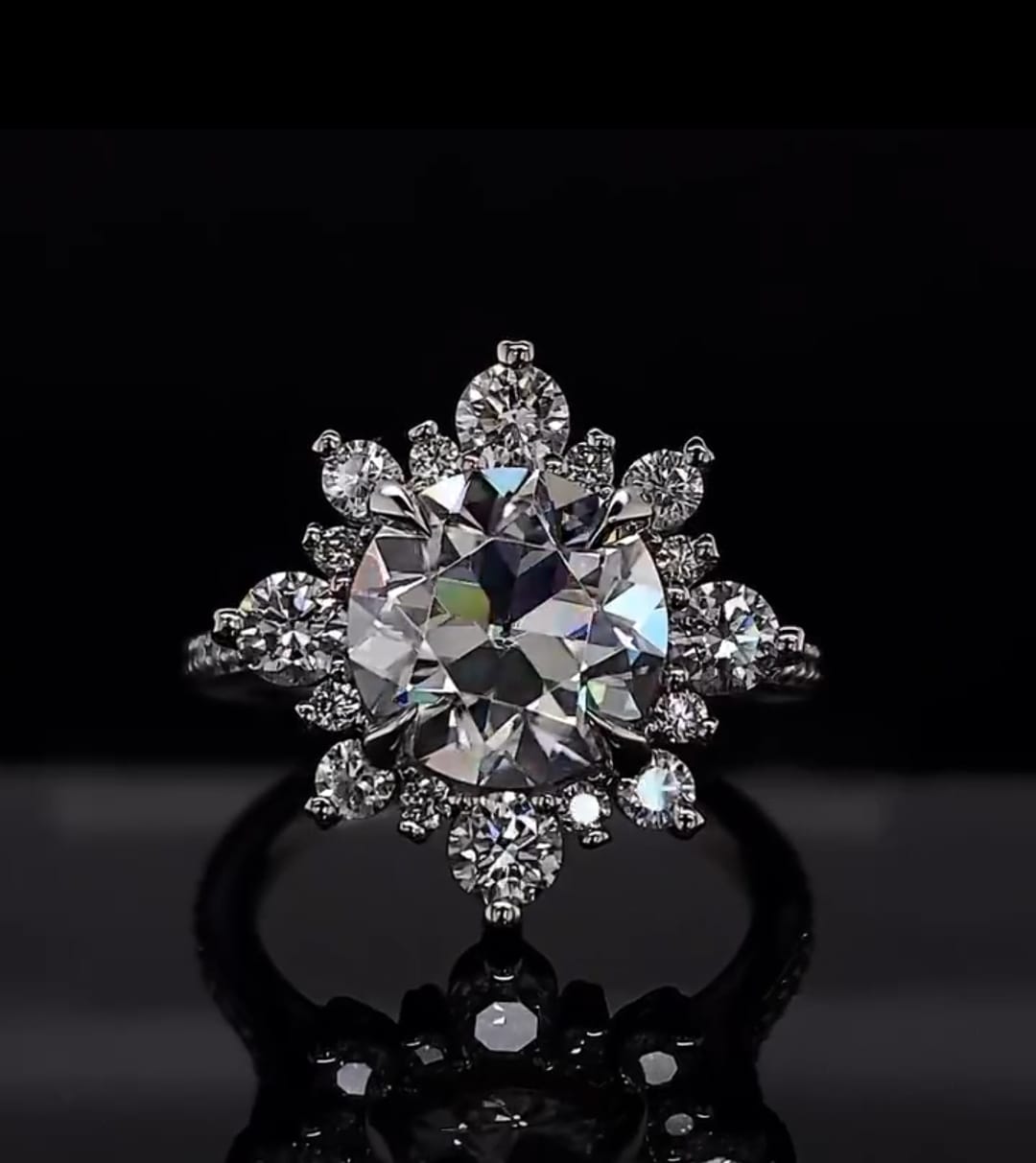 Front-facing shot of a 3 CT round lab grown diamond engagement ring with starburst halo detail