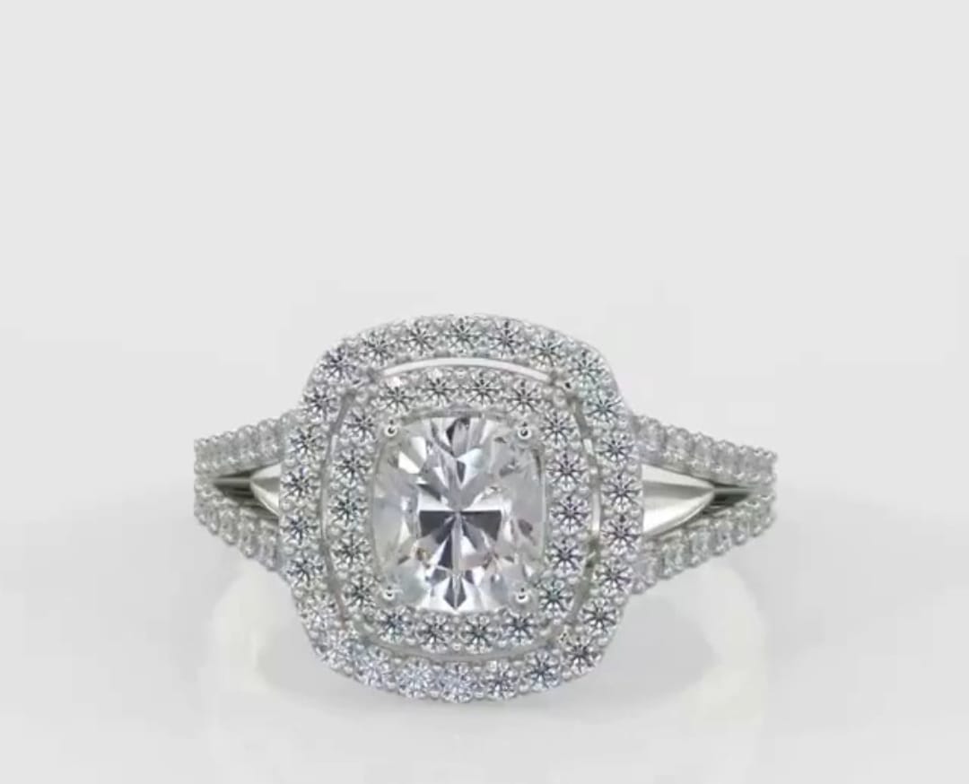 Top-down view showing the 2 carat cushion cut lab grown diamond encircled by a brilliant double halo