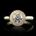 Close-up front view highlighting the brilliance and milgrain detail of a 2 carat round lab diamond halo ring