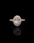 Top down front view of 3 CT oval cut lab grown diamond engagement ring with halo setting