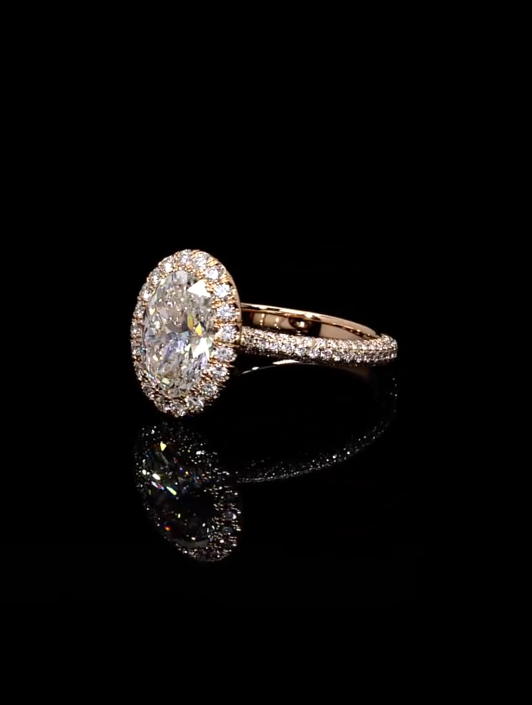 Perspective view displaying brilliance and reflection of 3 carat oval lab diamond halo ring