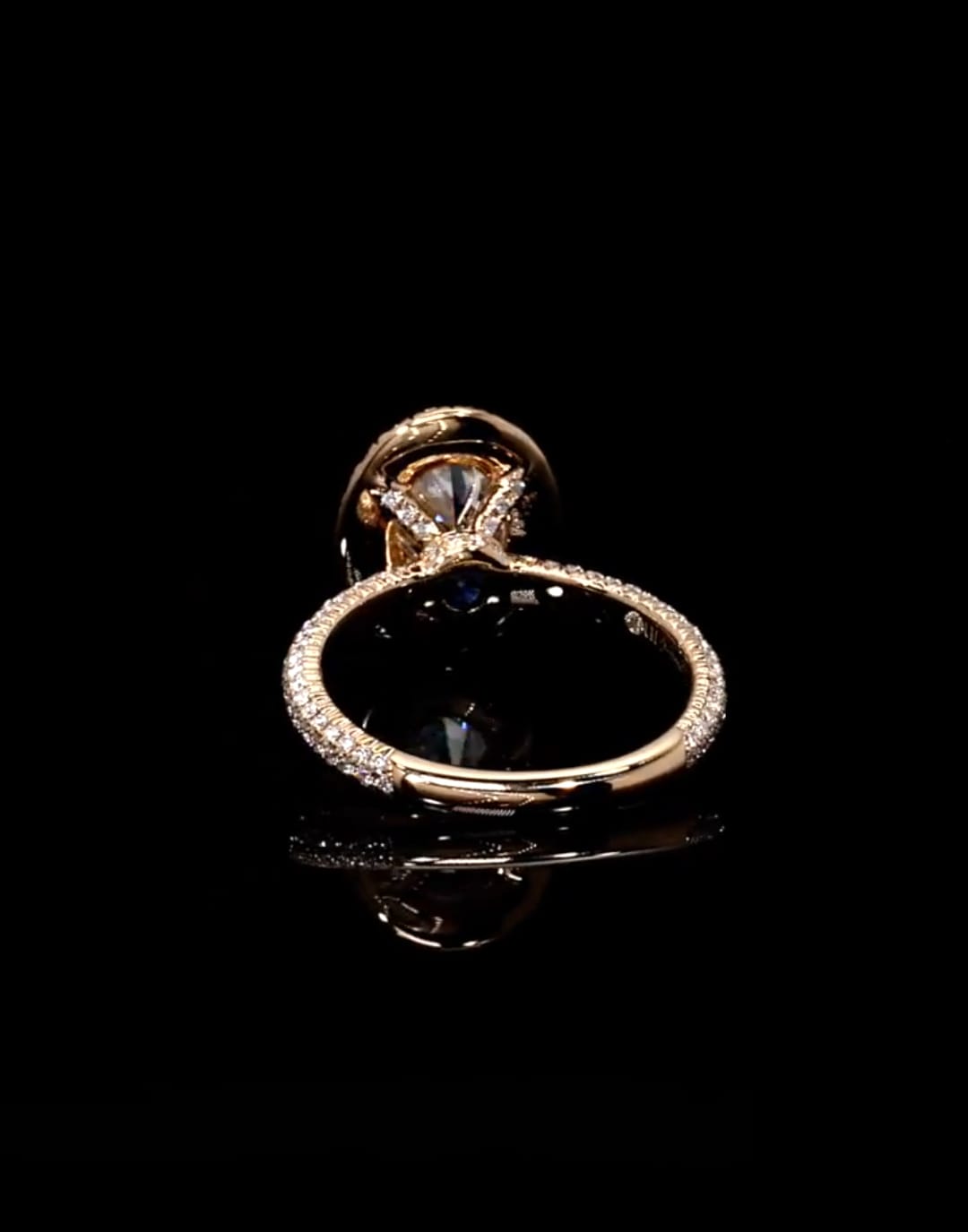 Underside gallery view detailing setting structure of 3 CT oval lab diamond ring in rose gold