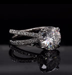 Angled perspective of 3 carat round lab grown diamond ring with criss-cross micro-pavé band