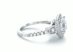 Side view showing cushion halo and side accent diamonds on white gold band