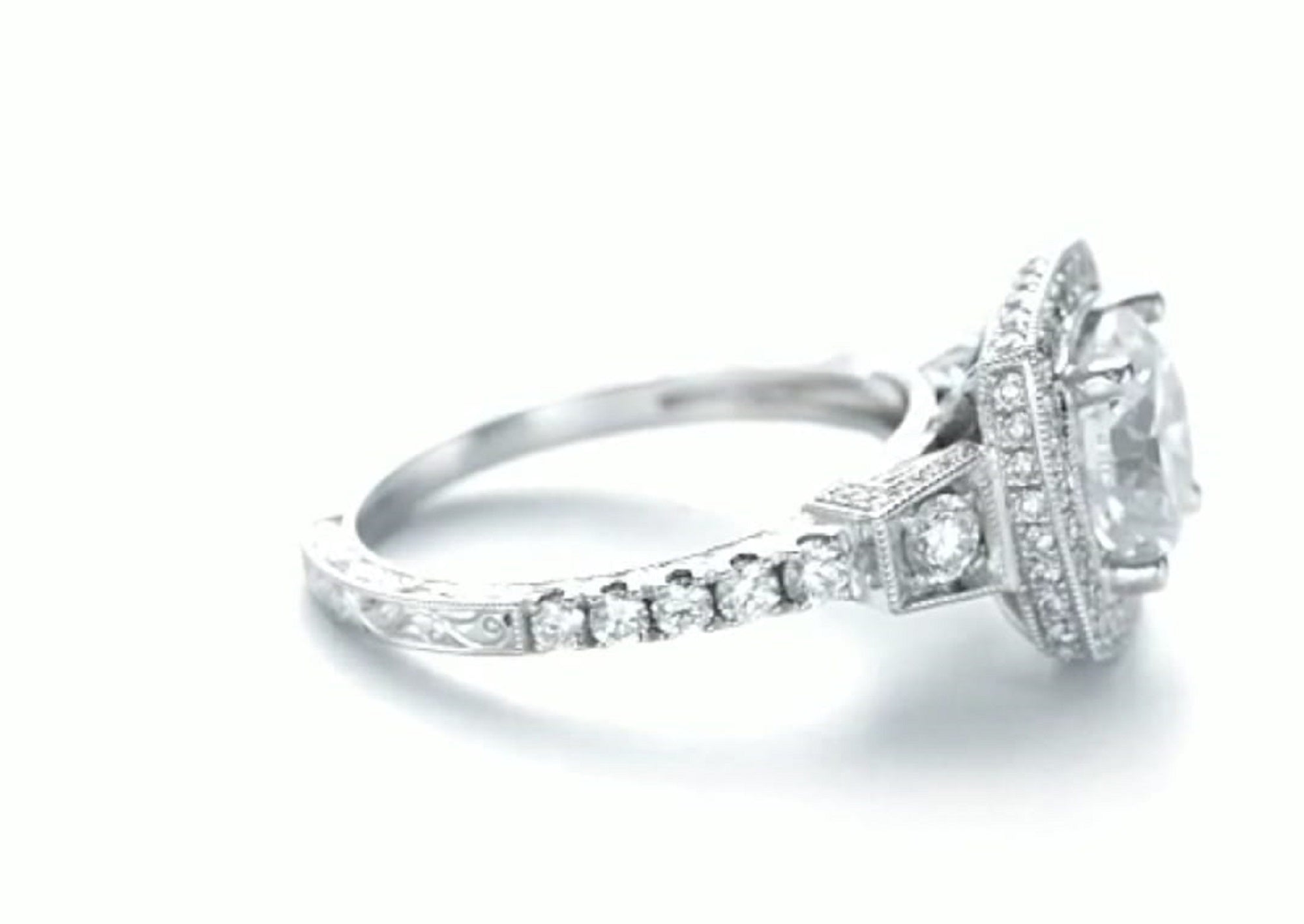 Side view showing cushion halo and side accent diamonds on white gold band
