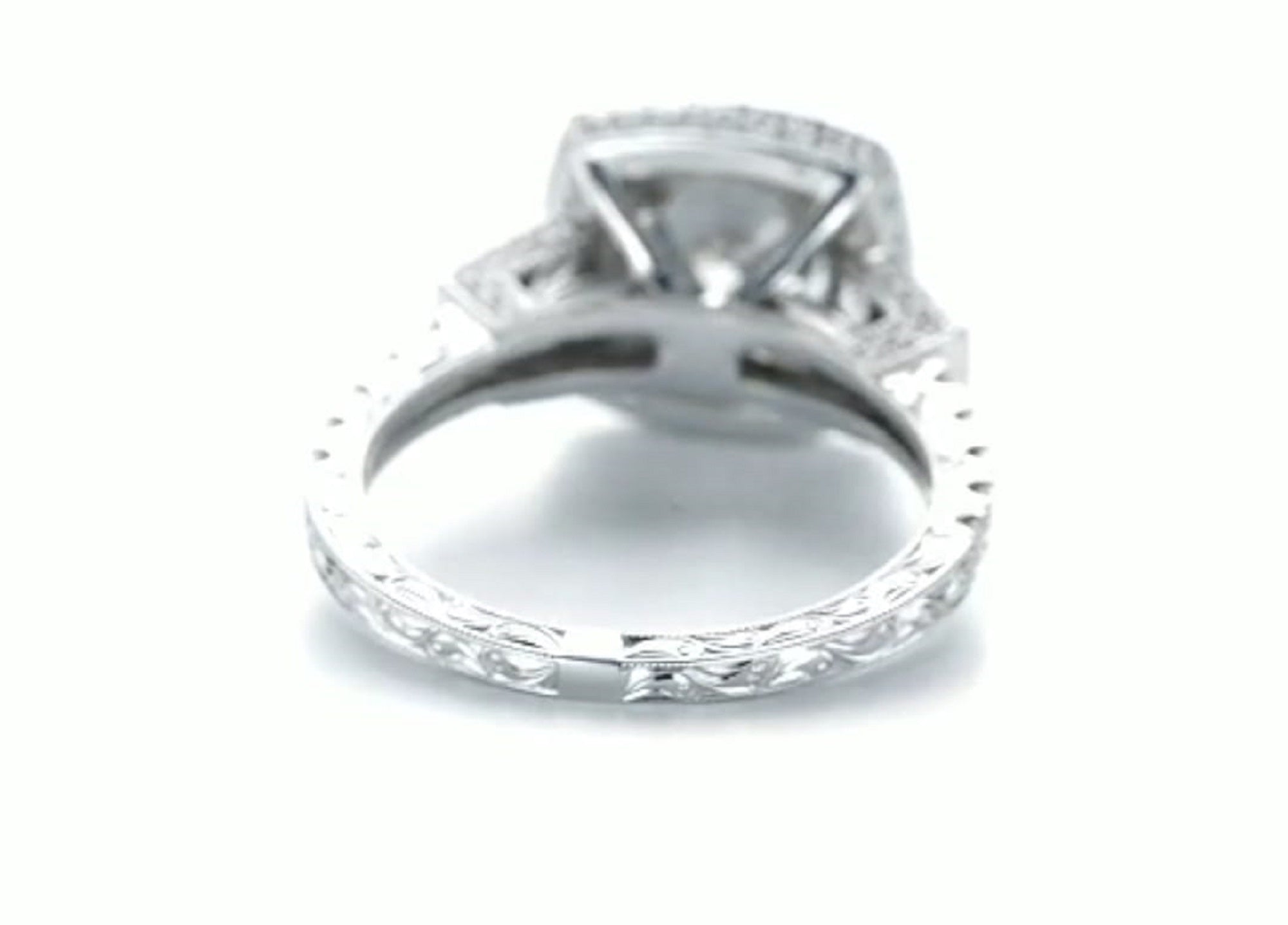 Close-up view of the hand-engraved scrollwork pattern on the ring shank