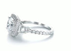 Angled view showing milgrain halo details and round lab diamond center