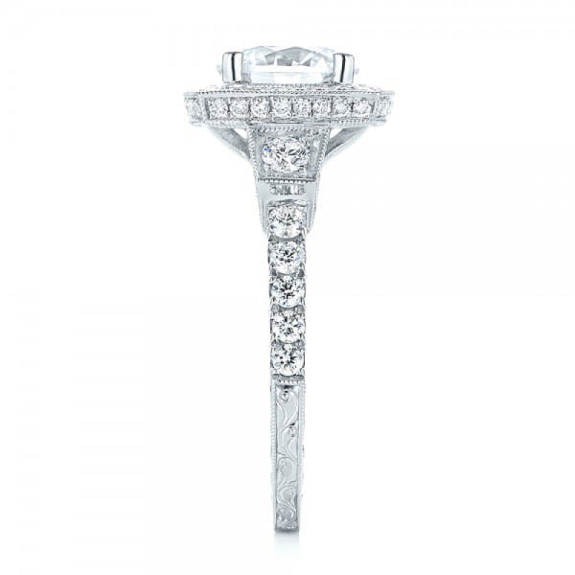 Studio side profile highlighting the pave band and cushion-shaped halo head
