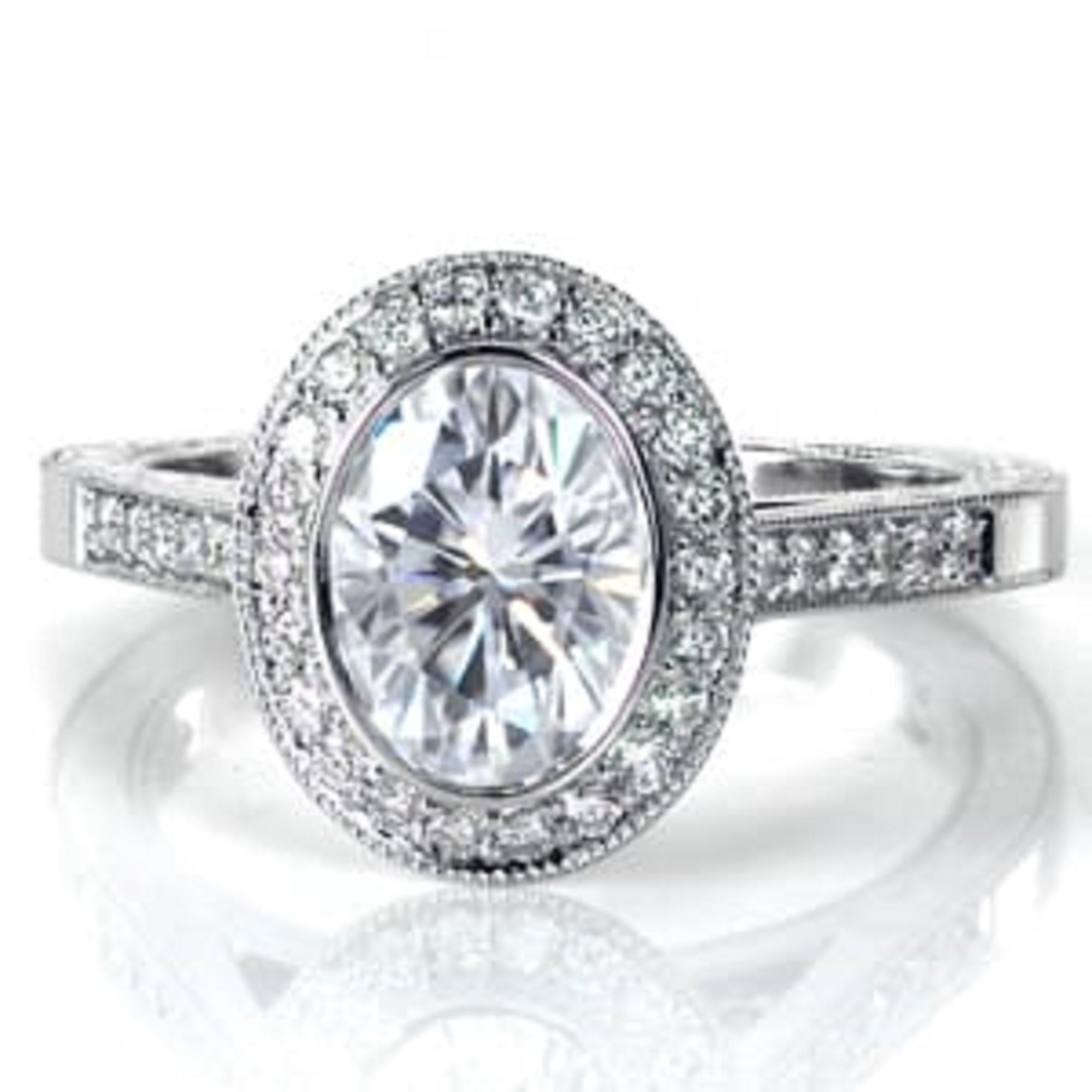 Front angle of 3 CT oval lab diamond engagement ring on white reflective background