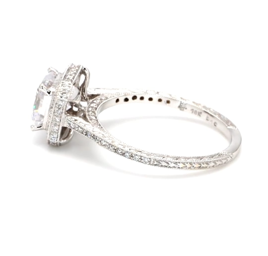 Gallery profile view showing 18k stamp, cathedral setting, and pave side accent diamonds