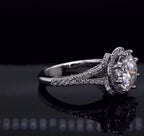 Side perspective showing split pave diamond cathedral shank and round lab diamond center stone