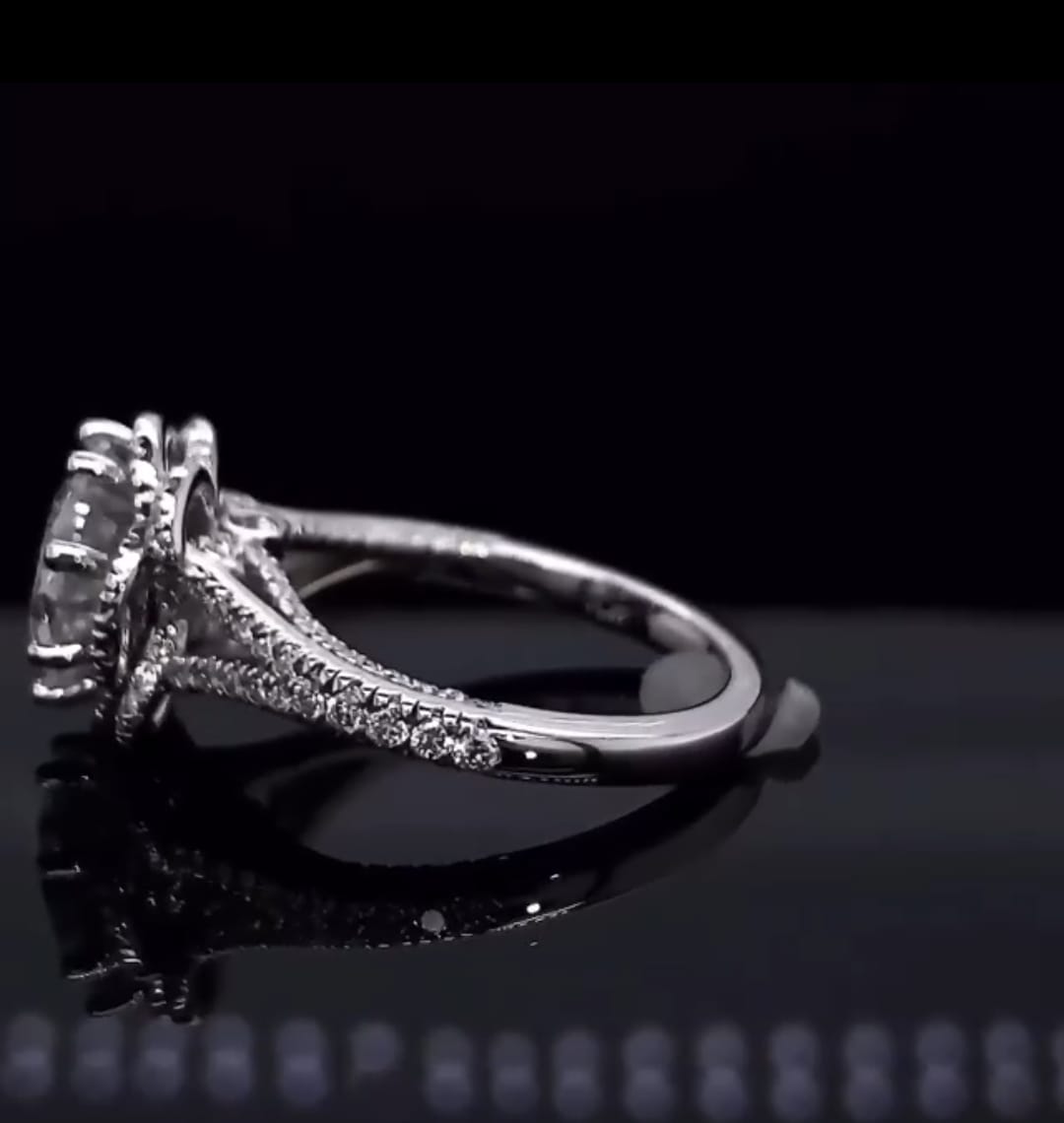 Low angle view of 3 CT round lab diamond engagement ring showing pave band and double halo construction