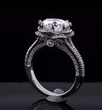 Detailed profile view highlighting hidden bezel-set diamond accent beneath the basket bridge