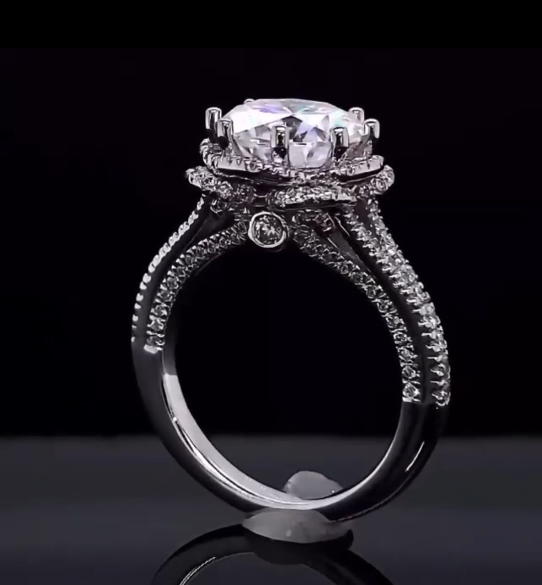 Detailed profile view highlighting hidden bezel-set diamond accent beneath the basket bridge