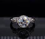 Front view of 3 CT round brilliant lab grown diamond ring with bezel setting and filigree shoulders
