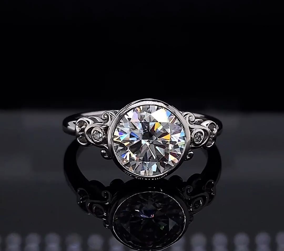 Front view of 3 CT round brilliant lab grown diamond ring with bezel setting and filigree shoulders