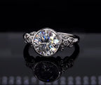 Close-up top view displaying brilliance of 3 CT round lab diamond and ornate filigree shoulder details