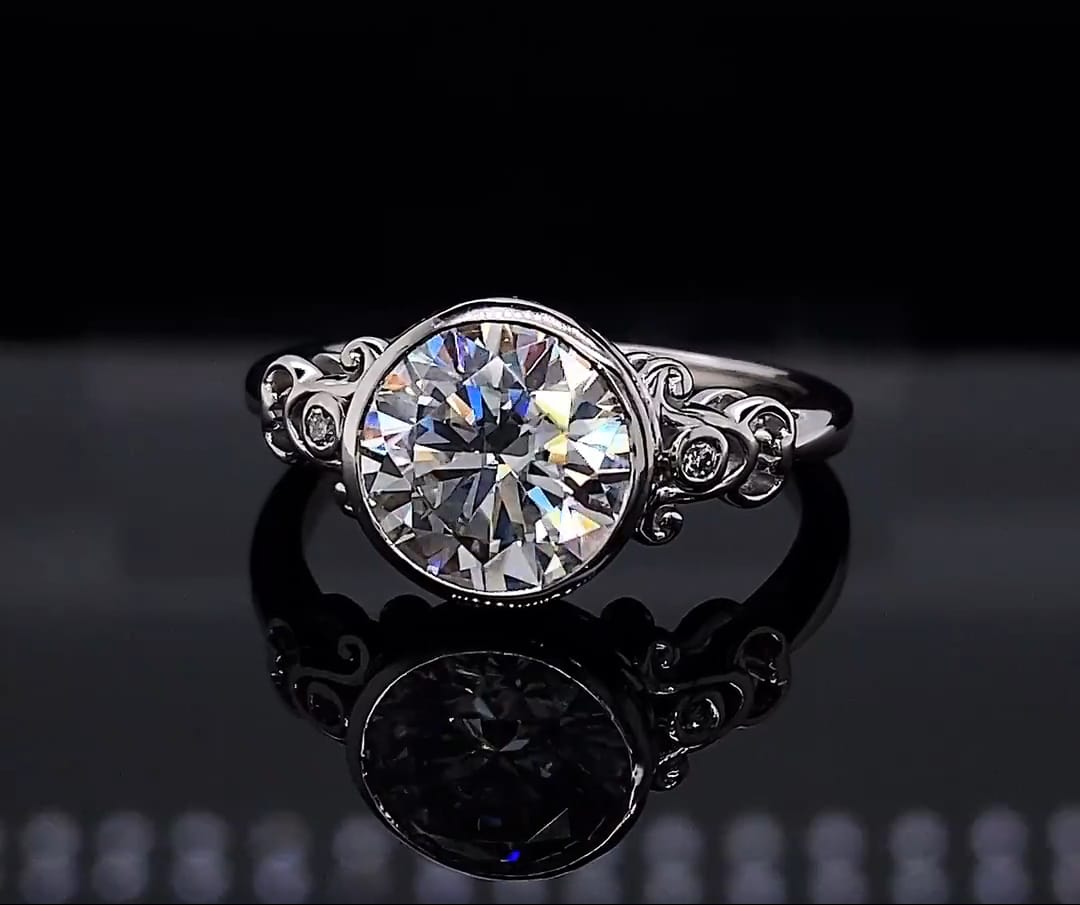 Close-up top view displaying brilliance of 3 CT round lab diamond and ornate filigree shoulder details
