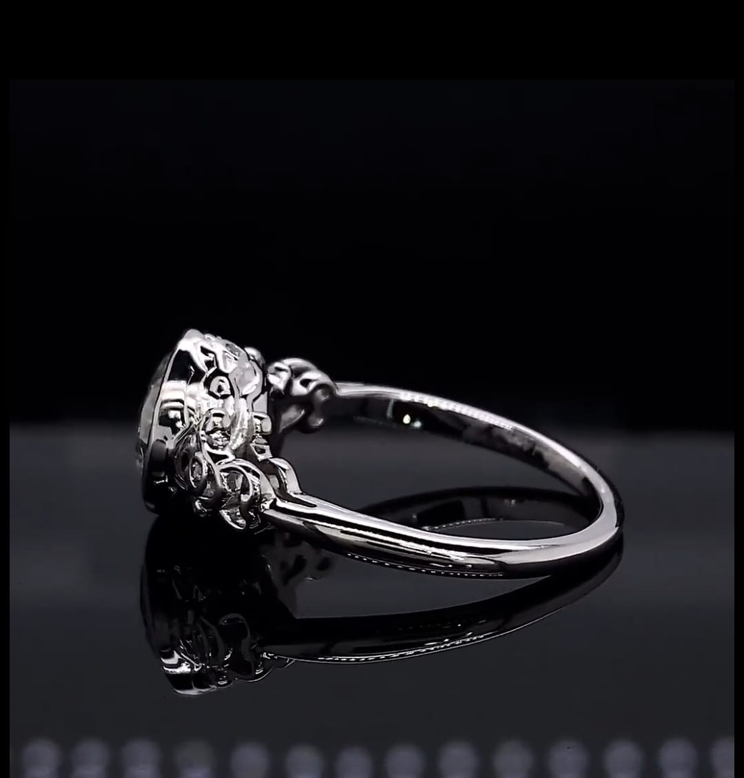 Side profile view highlighting the smooth platinum band and under-gallery scrollwork detailing