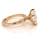 Side profile view of a 3 CT oval lab grown diamond solitaire ring in yellow gold