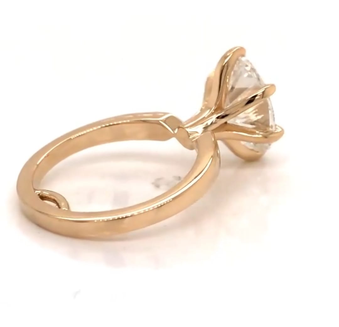 Perspective view showing the 6-prong head setting of a 3 carat oval lab diamond ring