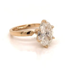 Three-quarter view displaying brilliance of a 3 CT oval lab diamond with tapered shoulder band