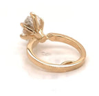 Low angle view highlighting the yellow gold basket construction of 3 carat oval solitaire ring