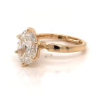Elevated view showing 3 CT oval lab diamond held securely in 6 prongs on yellow gold band