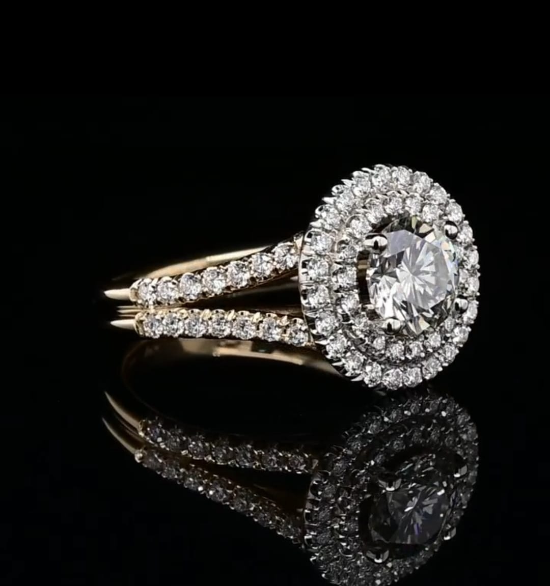 Side angle view of a 2 CT round lab grown diamond engagement ring with double halo and split shank band on a black background.