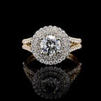 Top-down view of a 2 carat round lab-created diamond double halo ring in yellow gold with mirror reflection.